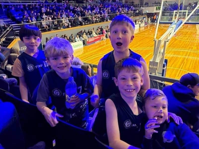 Young Bobcats in their club tops in the crowd